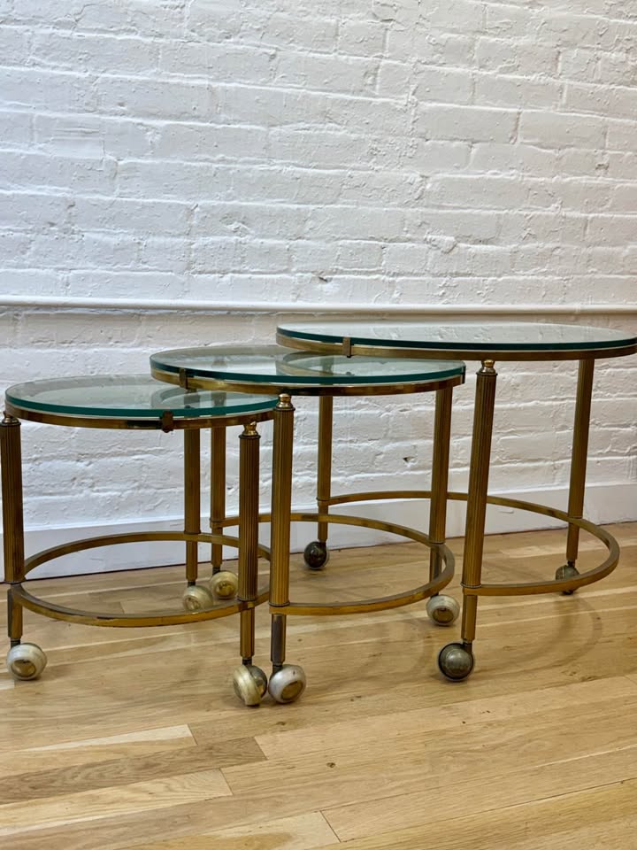 Antique Three Piece Brass and Glass Nesting Side Tables on Castor Wheels
