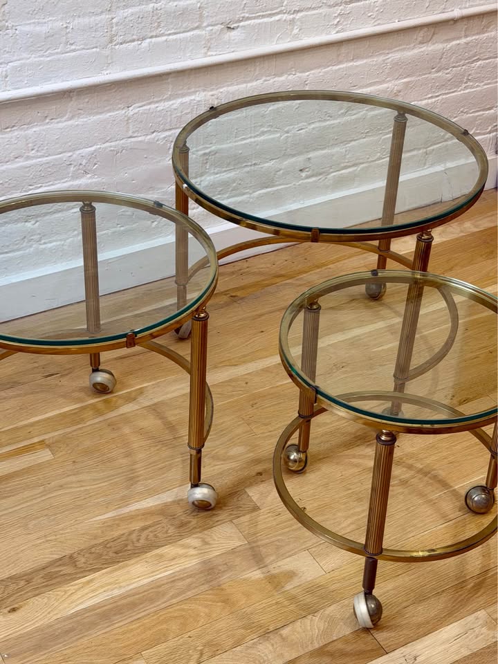 Antique Three Piece Brass and Glass Nesting Side Tables on Castor Wheels