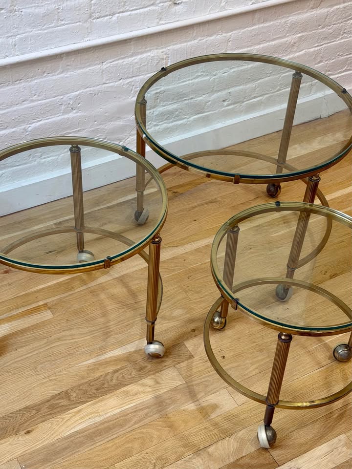 Antique Three Piece Brass and Glass Nesting Side Tables on Castor Wheels